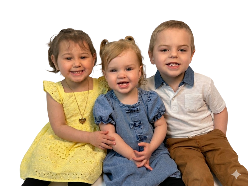 Three children smiling